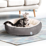 round donut pet bed for cats and small dogs | soft washable pet bed anti slip water resistant base | calming donut cat bed soft plush cushion gray | cozy round pet bed for indoor cats and puppies | anti anxiety pet bed donut shape soft warm bed | water resistant dog bed for small pets washable cushion | fluffy donut pet bed for deep sleep and comfort